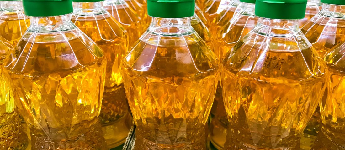 Closed up pile of bottled palm oil in the market